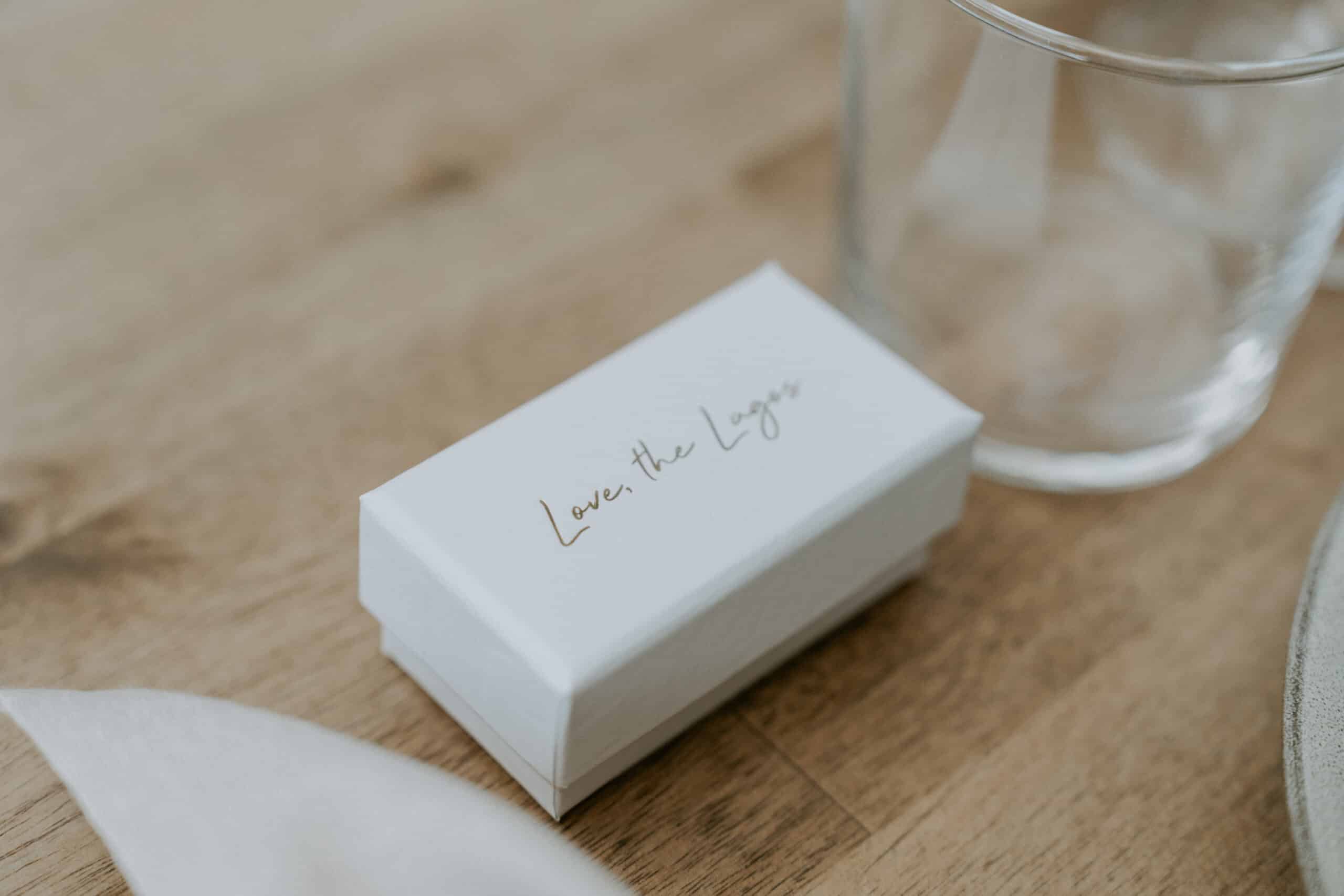 custom wedding favours with the inscription ''the lagos'' hotfoiled on the box lid